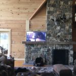 Hidden TV cabinet in a brick fireplace