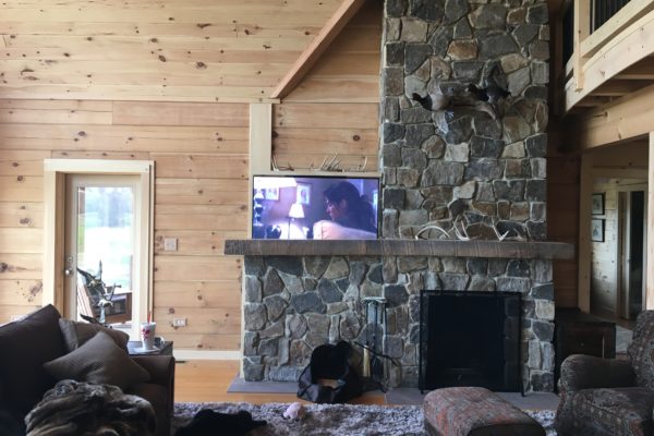 Hidden TV cabinet in a brick fireplace