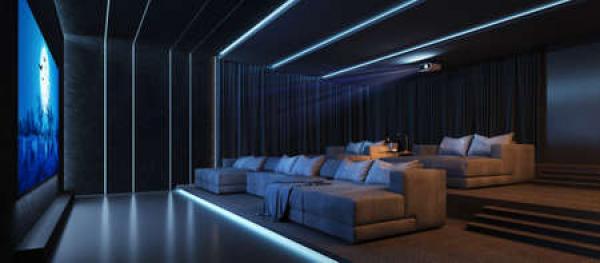 A home theater system with a bunch of easy chairs
