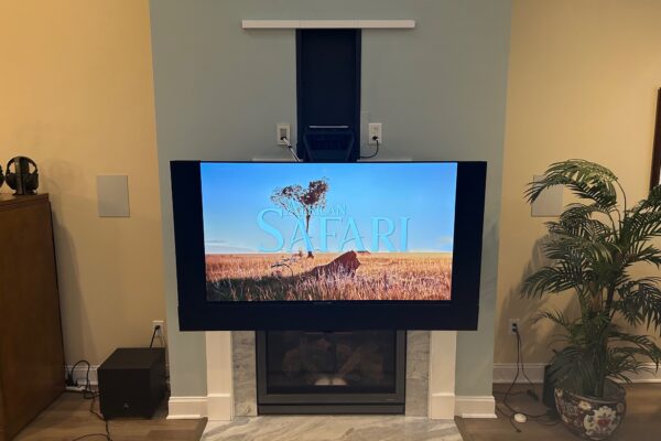 Mantle mount tv lift down