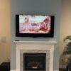Fireplace mantle mount TV lift up